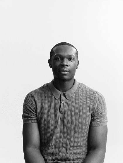 Portrait of Marvin Ngonadi, seated, in black and white
