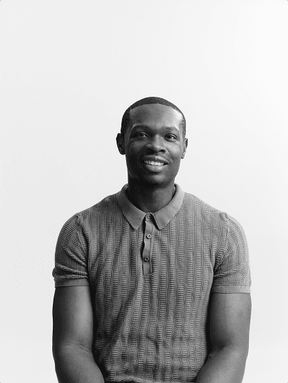 Portrait of Marvin Ngonadi smiling, in black and white